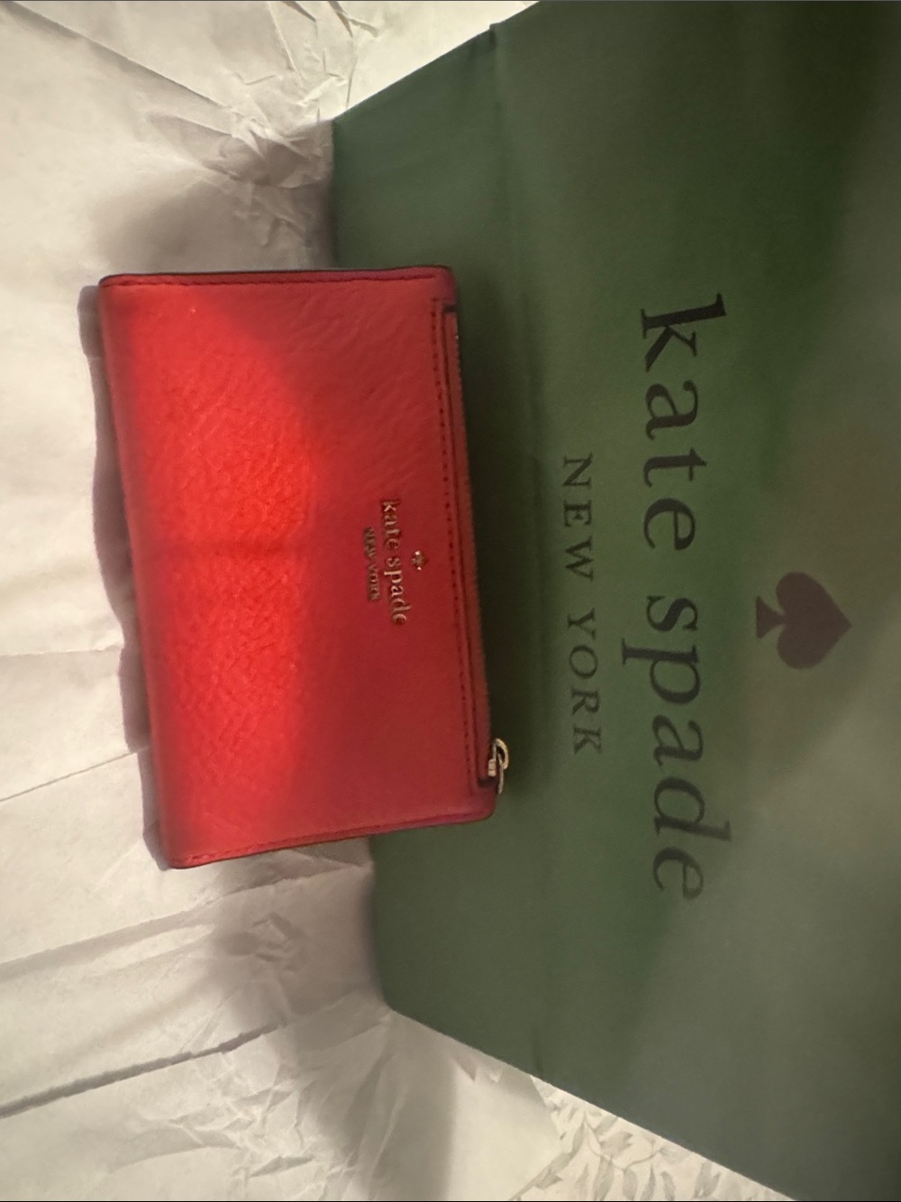 kate spade red leather zip-around wallet with gold logo